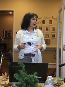 Lees facilitating a writers group at an assisted living residence.
